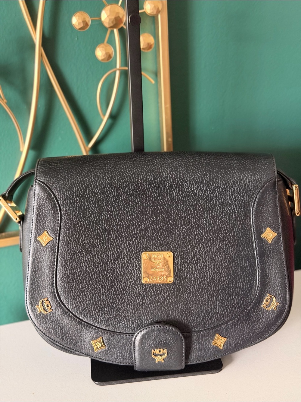 MCM Black Pebbled Leather Crossbody Bag with Gold Accents